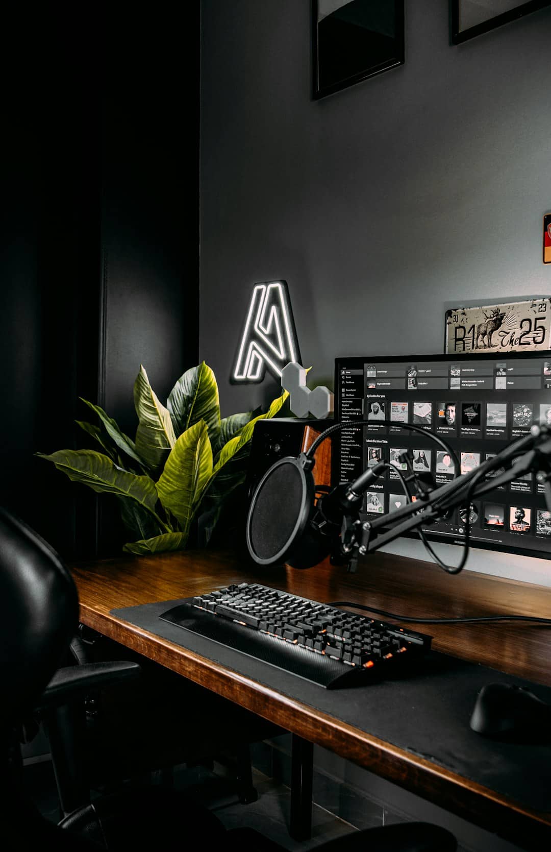 a desk with a keyboard and a monitor